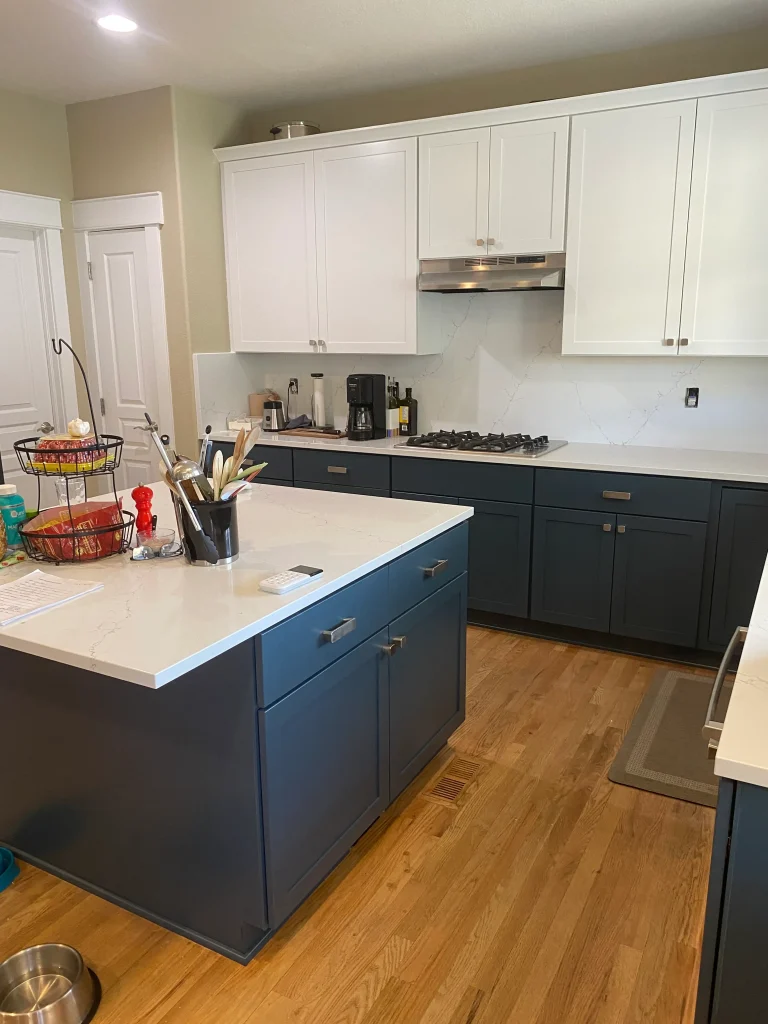 Denver kitchen transformation after cabinet refacing with white cabinets and navy base cabinets